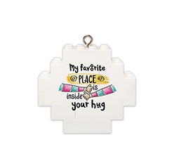 Pallina di natale in mattoncini con grafica abbraccio