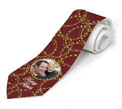 Cravatta con grafica rossa e dorata di Natale