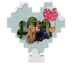 Puzzle mattoncini cuore grafica mongolfiera