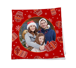 Tovagliolo in tessuto con guanti natalizi e un riquadro tondo