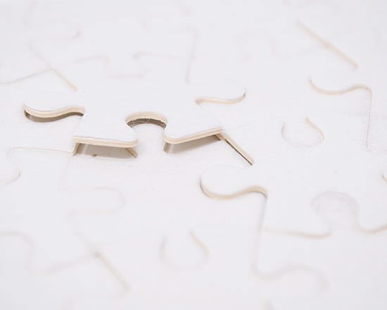 dettaglio tasselli del puzzle in tessuto