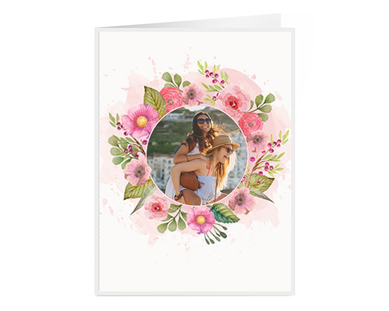 Biglietto auguri con cornice di fiori stilizzata e foto